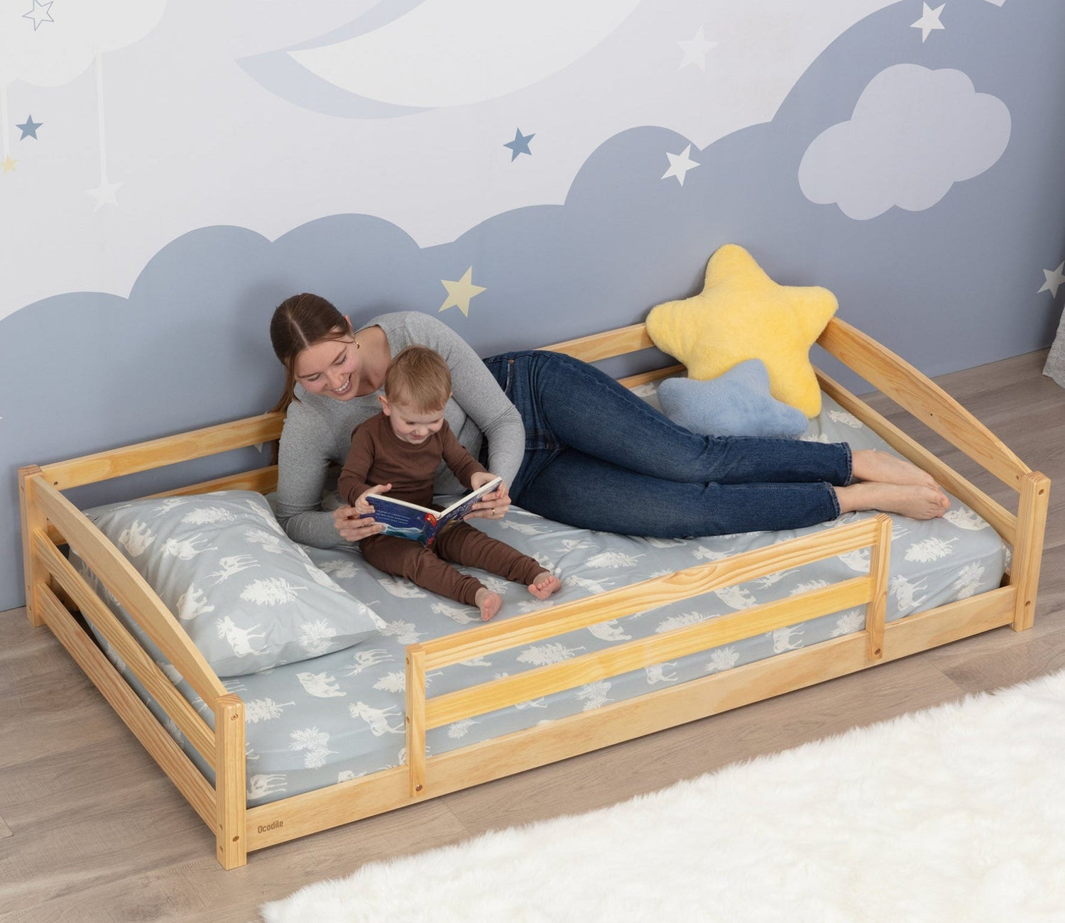 Woman and child on a wooden Montessori inspired floor bed 