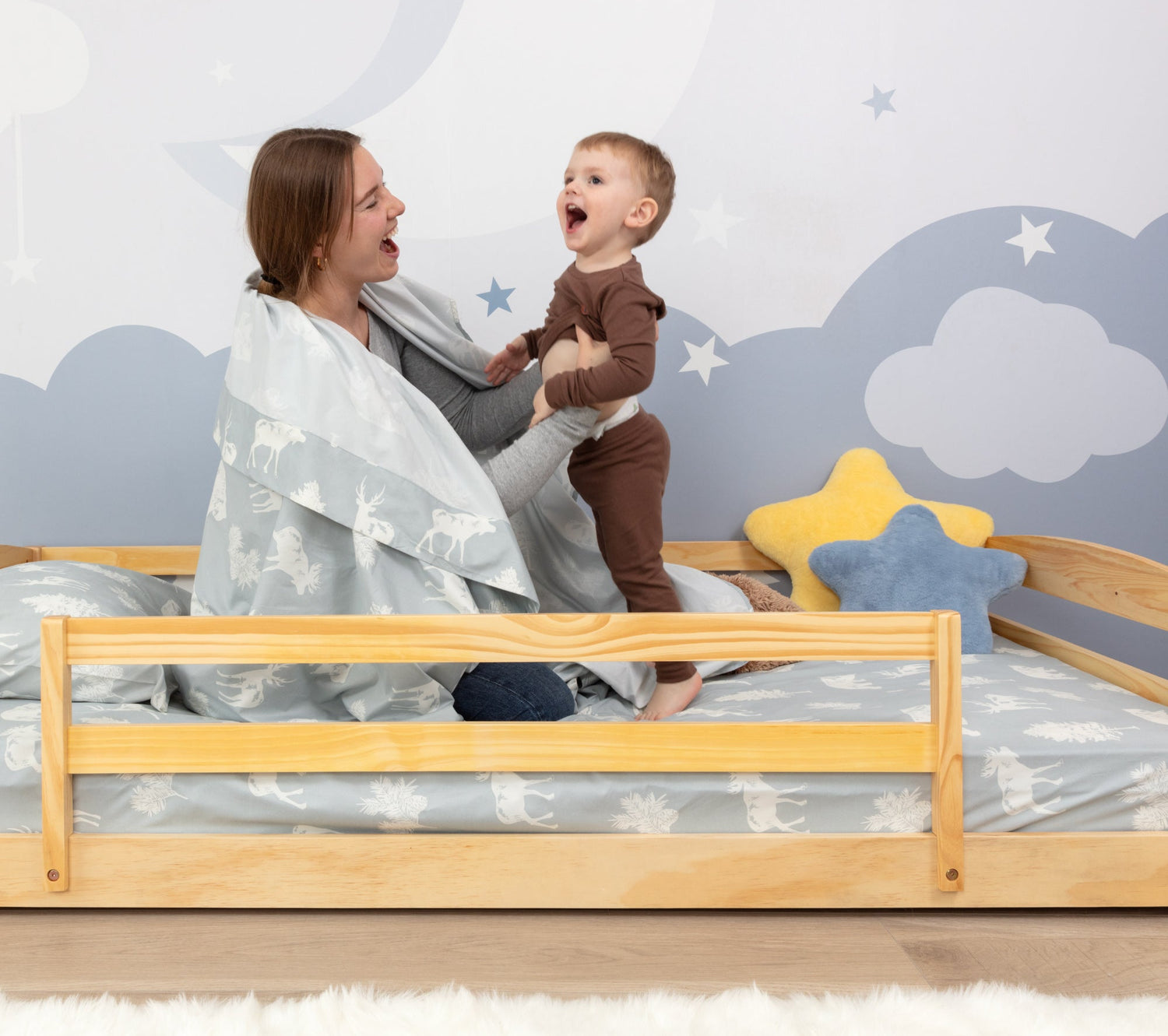 Woman and child on a floor bed Montessori type